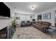 Spacious living room with fireplace, flat-screen TV, and comfortable seating for entertaining at 2651 Martha Dr, North Charleston, SC 29405