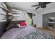 Spacious bedroom featuring a window with dark curtains, wood floors, and decorative shelves at 2651 Martha Dr, North Charleston, SC 29405