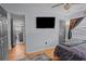 Main bedroom featuring hardwood floors, a TV, a full en-suite bathroom, and natural light at 2651 Martha Dr, North Charleston, SC 29405