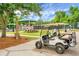 A community golf cart sits beside a playground, picnic area and tennis courts in this well landscaped and shady recreation area at 2701 Four Winds Pl, Mount Pleasant, SC 29466