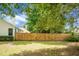 Back yard with mature trees and privacy fence at 2701 Four Winds Pl, Mount Pleasant, SC 29466