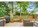 Spacious back yard with a well-maintained wooden deck, perfect for outdoor dining and relaxing in a serene setting at 2701 Four Winds Pl, Mount Pleasant, SC 29466