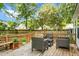 Enjoy outdoor living on the wooden deck in a lush backyard surrounded by mature trees, creating a private retreat at 2701 Four Winds Pl, Mount Pleasant, SC 29466