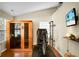 Bright exercise room with wood floors, high ceilings, sauna and exercise bike at 2701 Four Winds Pl, Mount Pleasant, SC 29466