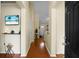 Bright hallway featuring hardwood floors, neutral paint and high ceilings at 2701 Four Winds Pl, Mount Pleasant, SC 29466