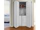 Stacked laundry units hidden behind folding doors, maximizing space and adding convenience in this home at 2701 Four Winds Pl, Mount Pleasant, SC 29466