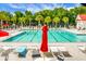Resort-style community pool with plenty of seating and lush landscaping at 2701 Four Winds Pl, Mount Pleasant, SC 29466