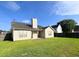 This spacious backyard features a lush lawn, partial fence, patio, and easy access to the home at 286 Westbrooke Rd, Summerville, SC 29486