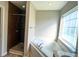 Primary bath features walk-in shower and soaking tub with a large window at 286 Westbrooke Rd, Summerville, SC 29486