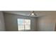 This bedroom is bright, featuring a ceiling fan and natural light from the window at 286 Westbrooke Rd, Summerville, SC 29486