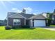 Charming one-story brick home with attached two car garage and well maintained lawn at 286 Westbrooke Rd, Summerville, SC 29486