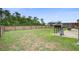Large, grassy backyard featuring a grill, trampoline, and a wood fence at 309 Squire Pope Rd Rd, Summerville, SC 29486