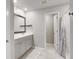 Bright bathroom with double sinks, large mirror, and a separate room with a shower and toilet at 309 Squire Pope Rd Rd, Summerville, SC 29486