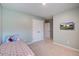 A bedroom featuring light green walls, carpet, a closet, and a TV at 309 Squire Pope Rd Rd, Summerville, SC 29486