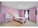 Bright bedroom with purple walls, carpeted floors, a vanity, and a comfortable bed at 309 Squire Pope Rd Rd, Summerville, SC 29486