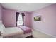Bedroom with a purple wall, a window with curtains, and a comfortable bed with pillows at 309 Squire Pope Rd Rd, Summerville, SC 29486
