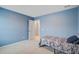 A bedroom features blue walls, carpet, and a bed at 309 Squire Pope Rd Rd, Summerville, SC 29486