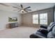 Spacious bonus room featuring neutral carpeting, ceiling fan, mounted TV, and comfortable seating at 309 Squire Pope Rd Rd, Summerville, SC 29486