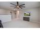 Open bonus room with neutral carpeting, ceiling fan, and media cabinet for versatile living space at 309 Squire Pope Rd Rd, Summerville, SC 29486