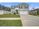 Charming two-story home with attached garage, well-manicured lawn, and inviting curb appeal at 309 Squire Pope Rd Rd, Summerville, SC 29486