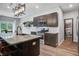 Bright kitchen with stainless appliances, a granite island with bar seating, and access to the dining area at 309 Squire Pope Rd Rd, Summerville, SC 29486