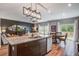 Open concept with a granite island, sleek appliances, and dining area with natural light enhance the modern design at 309 Squire Pope Rd Rd, Summerville, SC 29486