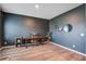 Bright living room featuring wood floors, gray wall, desk, and natural light at 309 Squire Pope Rd Rd, Summerville, SC 29486