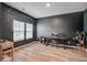 Bright living room featuring wood floors, gray wall, desk, and natural light at 309 Squire Pope Rd Rd, Summerville, SC 29486