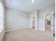 Neutral bedroom featuring two entry ways, and a view of a bathroom and workspace at 310 Marchman St, Summerville, SC 29486