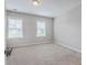 Spacious bedroom with neutral carpet, large windows, and ample natural light at 310 Marchman St, Summerville, SC 29486