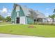 Community barn offers an open space with a well-maintained lawn and manicured landscape, creating a welcoming environment at 310 Marchman St, Summerville, SC 29486