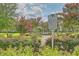 A beautiful landscaped community view featuring historical marker, decorative flowers, and a calming water fountain at 310 Marchman St, Summerville, SC 29486