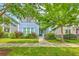 Charming two-story home with a well-manicured lawn and beautiful landscaping at 310 Marchman St, Summerville, SC 29486