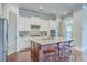 Bright kitchen includes stainless appliances, a gas cooktop, subway tile, and a large island at 310 Marchman St, Summerville, SC 29486