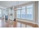 Inviting living room featuring hardwood floors, large windows and a cozy fireplace at 310 Marchman St, Summerville, SC 29486