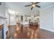 Open concept living room and kitchen featuring hardwood floors and modern design at 310 Marchman St, Summerville, SC 29486