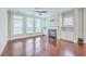 Comfortable living room boasts hardwood floors, fireplace and windows for lots of natural light at 310 Marchman St, Summerville, SC 29486