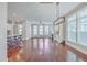 Bright and open-concept living area with hardwood floors and views into the kitchen at 310 Marchman St, Summerville, SC 29486