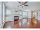 Spacious living room features hardwood floors, natural light, fireplace, and easy access to the staircase at 310 Marchman St, Summerville, SC 29486