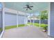 Screened-in porch featuring a ceiling fan and serene views of the backyard at 310 Marchman St, Summerville, SC 29486