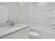 Bright bathroom with quartz countertops, modern fixtures, and a shower-tub combination at 3222 Pinewood Dr, Ladson, SC 29456