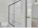 Modern bathroom with a sliding glass door shower enclosure, showcasing clean lines and contemporary design at 3222 Pinewood Dr, Ladson, SC 29456