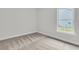 Bright bedroom with a neutral color scheme and large window allowing plenty of natural light at 3222 Pinewood Dr, Ladson, SC 29456