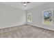 Carpeted bedroom with two large windows offering plenty of natural light and a cozy atmosphere at 3222 Pinewood Dr, Ladson, SC 29456
