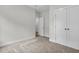 Comfortable carpeted bedroom featuring a double closet and an adjacent room at 3222 Pinewood Dr, Ladson, SC 29456