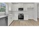 Well-lit kitchen with white cabinetry, stainless steel appliances, and modern countertops at 3222 Pinewood Dr, Ladson, SC 29456