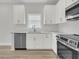 Modern kitchen with white cabinets, stainless steel appliances, and stylish countertops at 3222 Pinewood Dr, Ladson, SC 29456