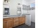 Elegant bathroom with dual sinks, granite countertops, wood cabinets, and a walk-in shower with patterned tile at 330 Trailmore Ln, Summerville, SC 29486