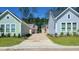 This street view displays well-maintained lawns and landscaping of new homes at 338 Trailmore Ln, Summerville, SC 29486