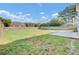 Large fenced-in backyard with a patio, lawn, and mature trees at 340 Albrighton Way, Moncks Corner, SC 29461